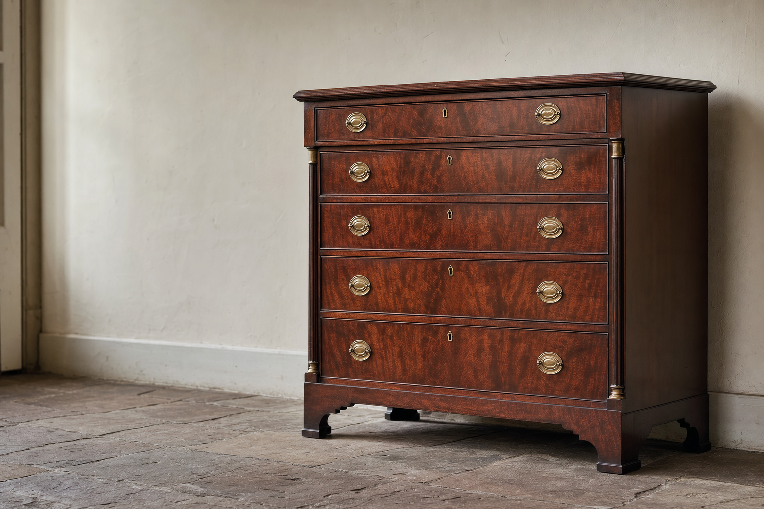 Restored Federal-period mahogany dresser with ribbon-grain front panels and brass pull hardware