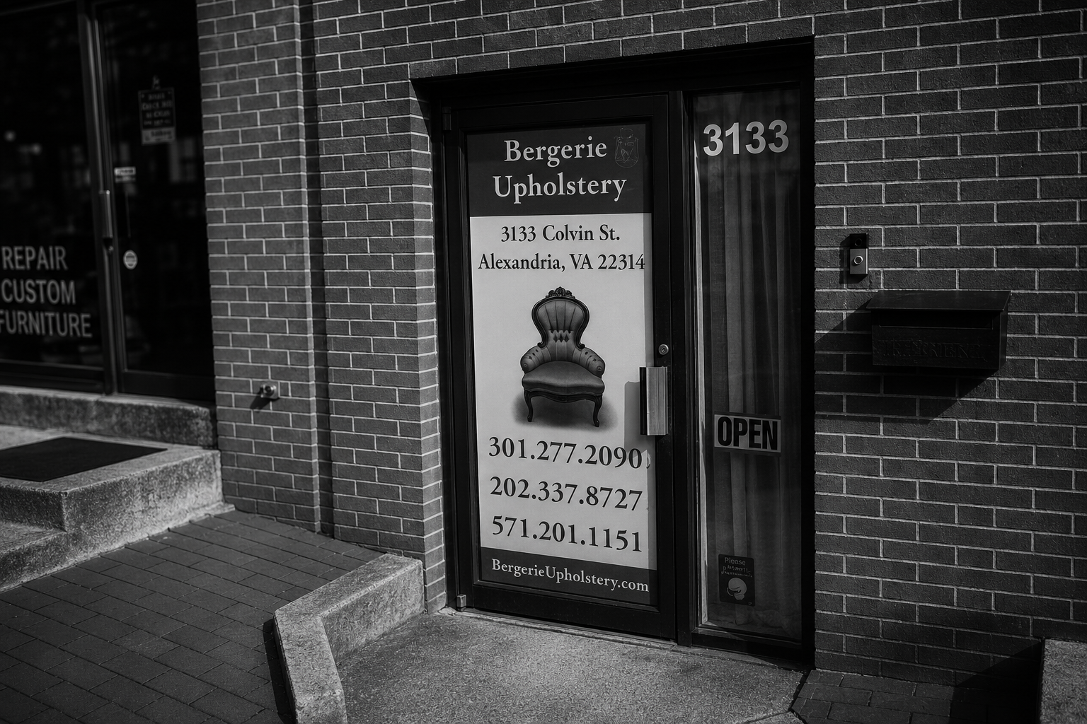 Bergerie Upholstery storefront at 3133 Colvin Street, Alexandria VA: glass door with the workshop's signature Bergère armchair logo, address, phone numbers, and an OPEN sign.